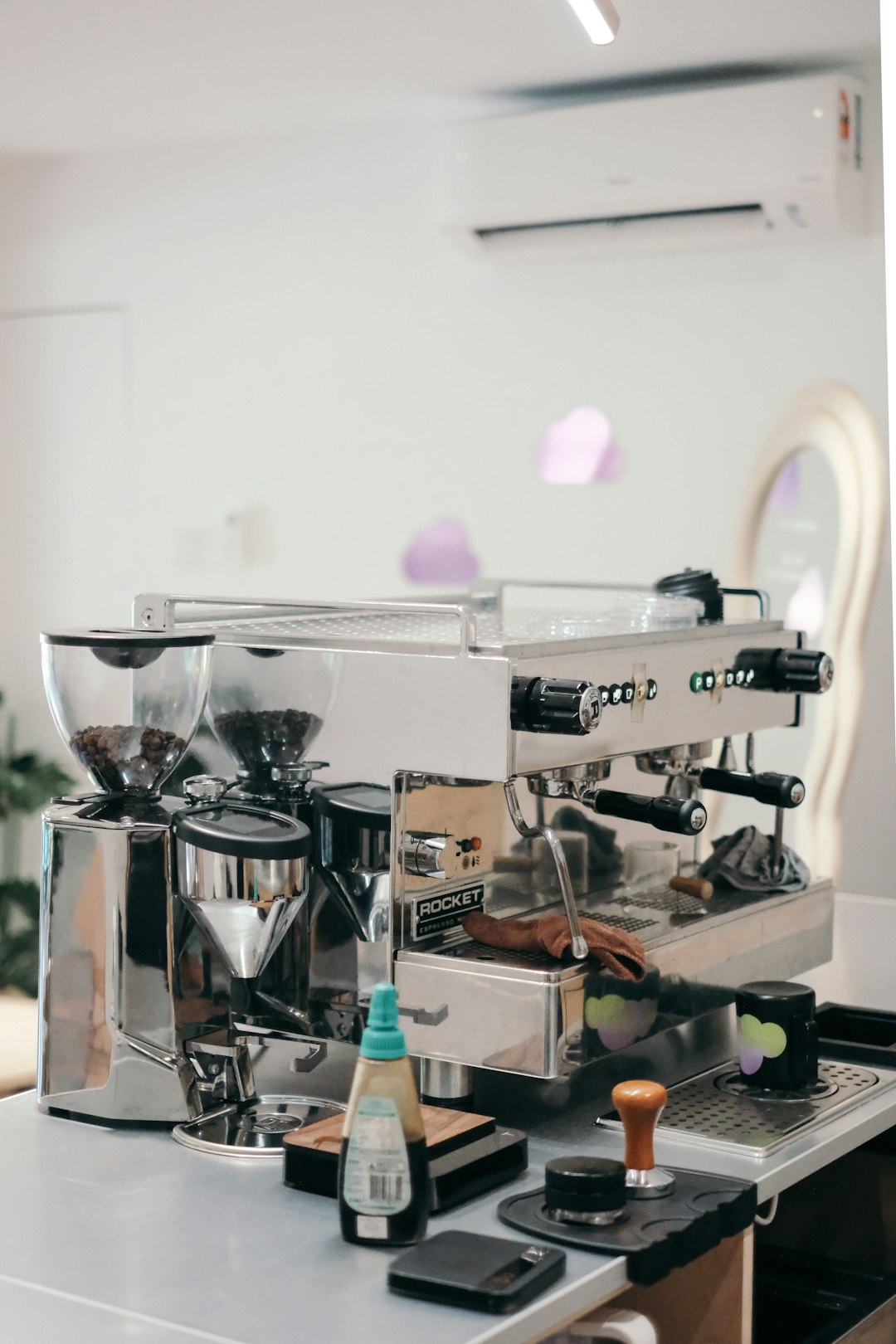 Professional espresso machine and coffee grinder setup in a cafe